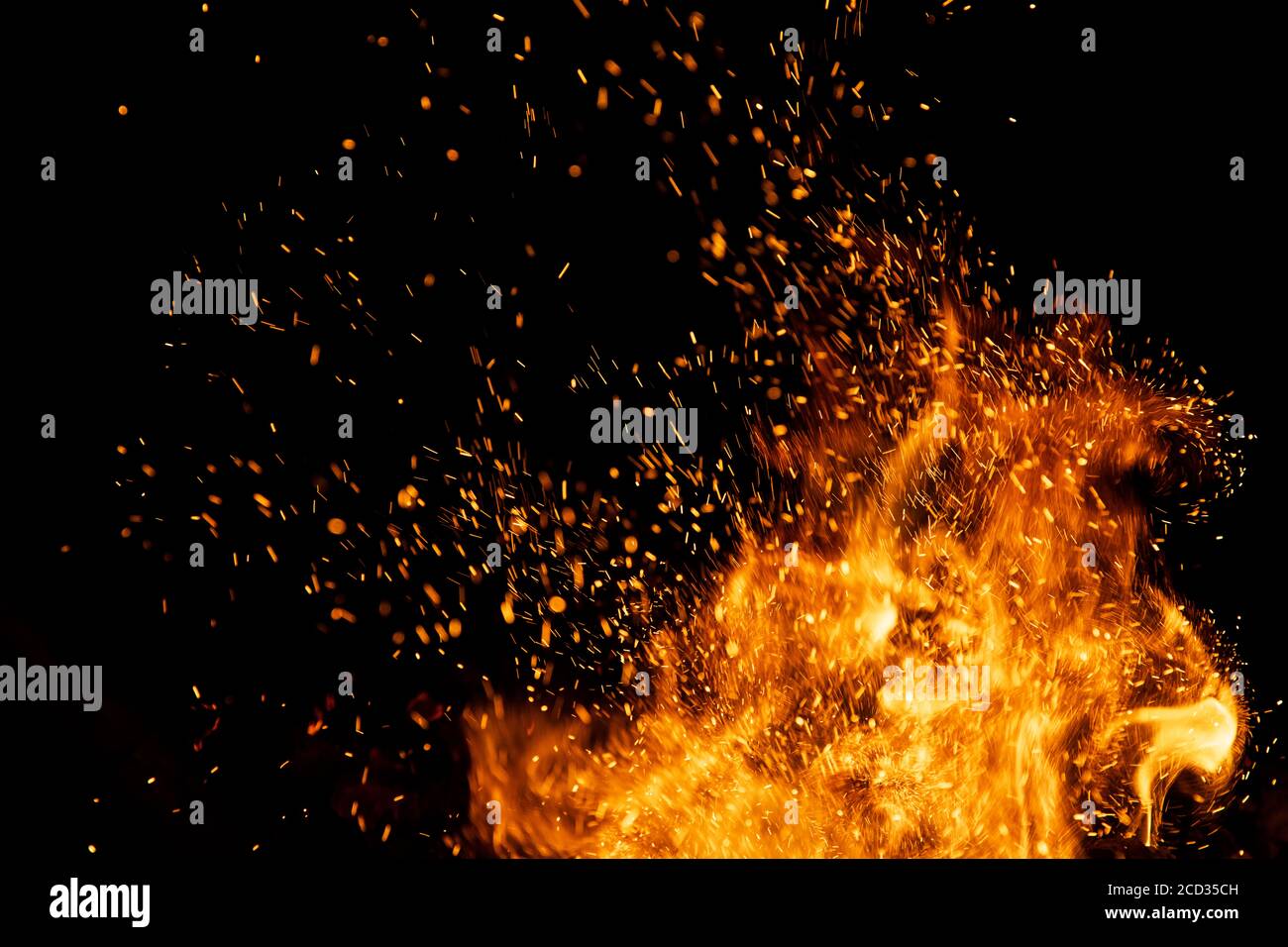 Fire sparks particles with flames isolated on black background Stock Photo  - Alamy