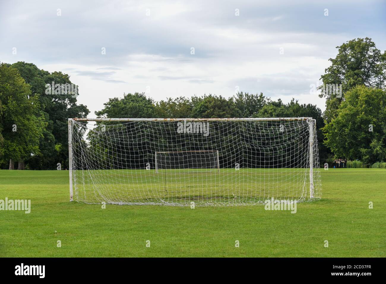 Outdoor football pitch with goals and soccer nets in public park Stock Photo
