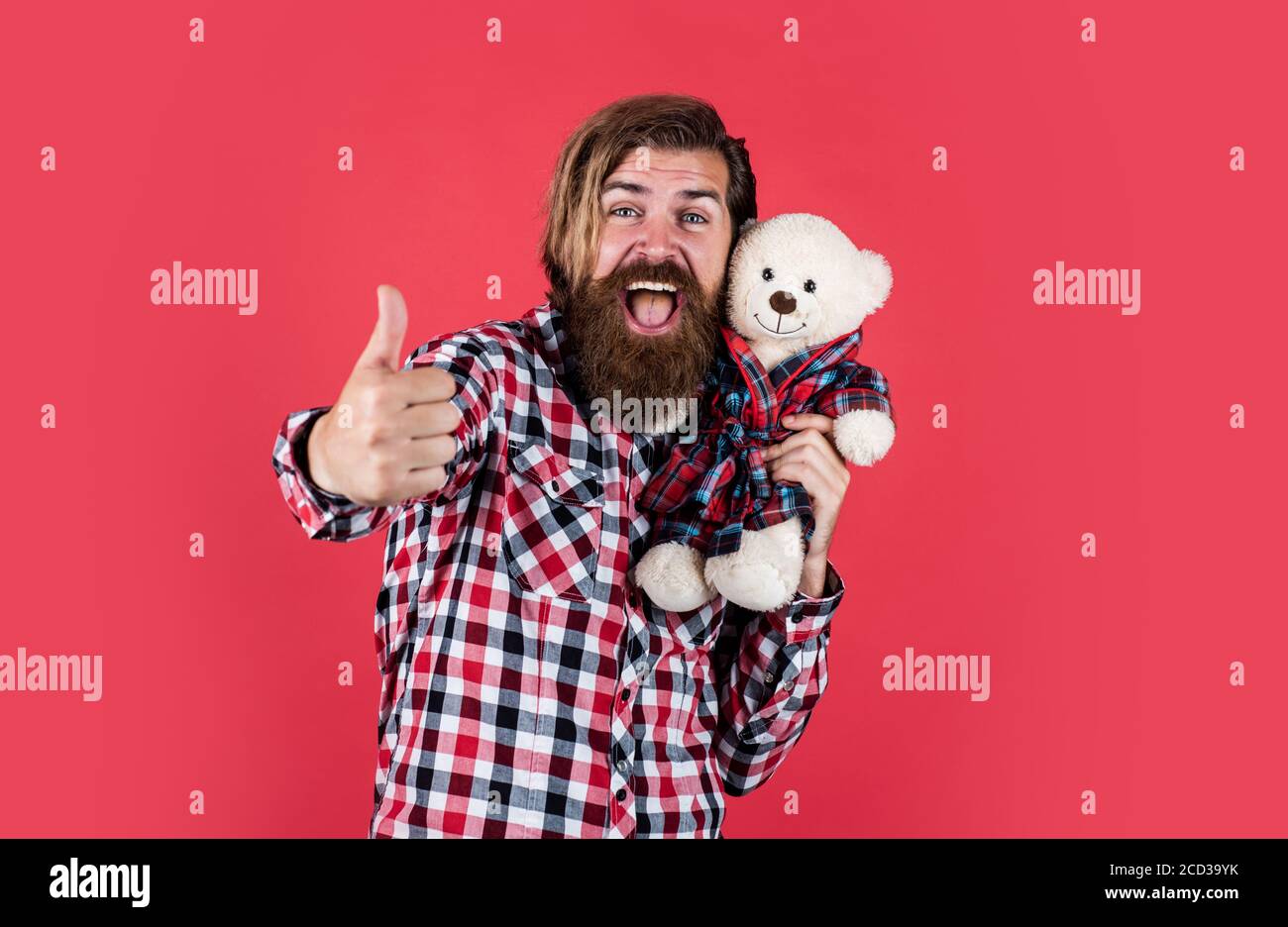 best offer. Man holds teddy bear. Gifts and holidays concept. This is for you. hipster like animal toy. Birthday holiday party celebration. feel happiness. Man with beard hold cute toy bear. Stock Photo