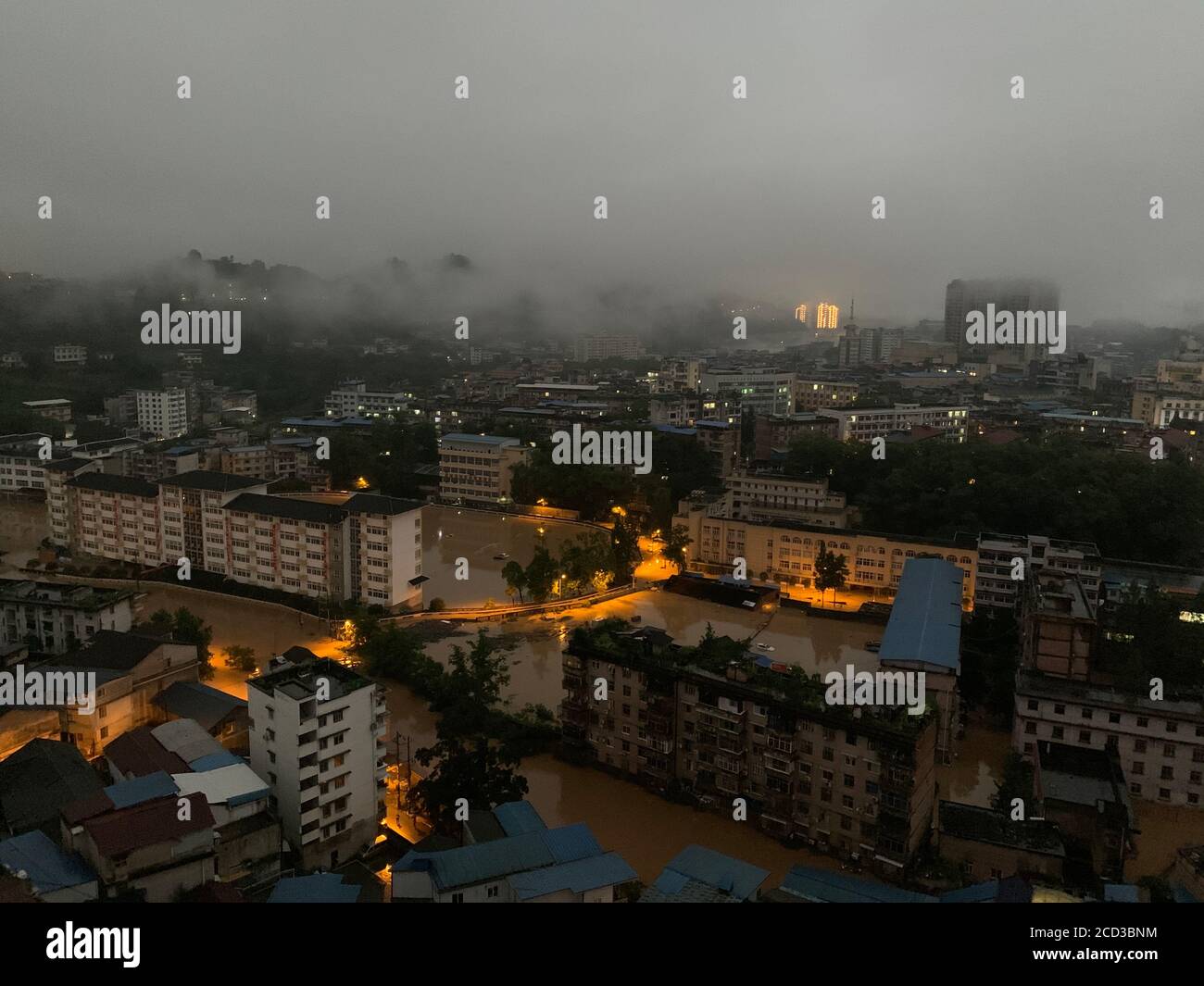 Aerial view of residential buildings flooded in Enshi city, south China's Hubei province, 17 July 2020. Stock Photo
