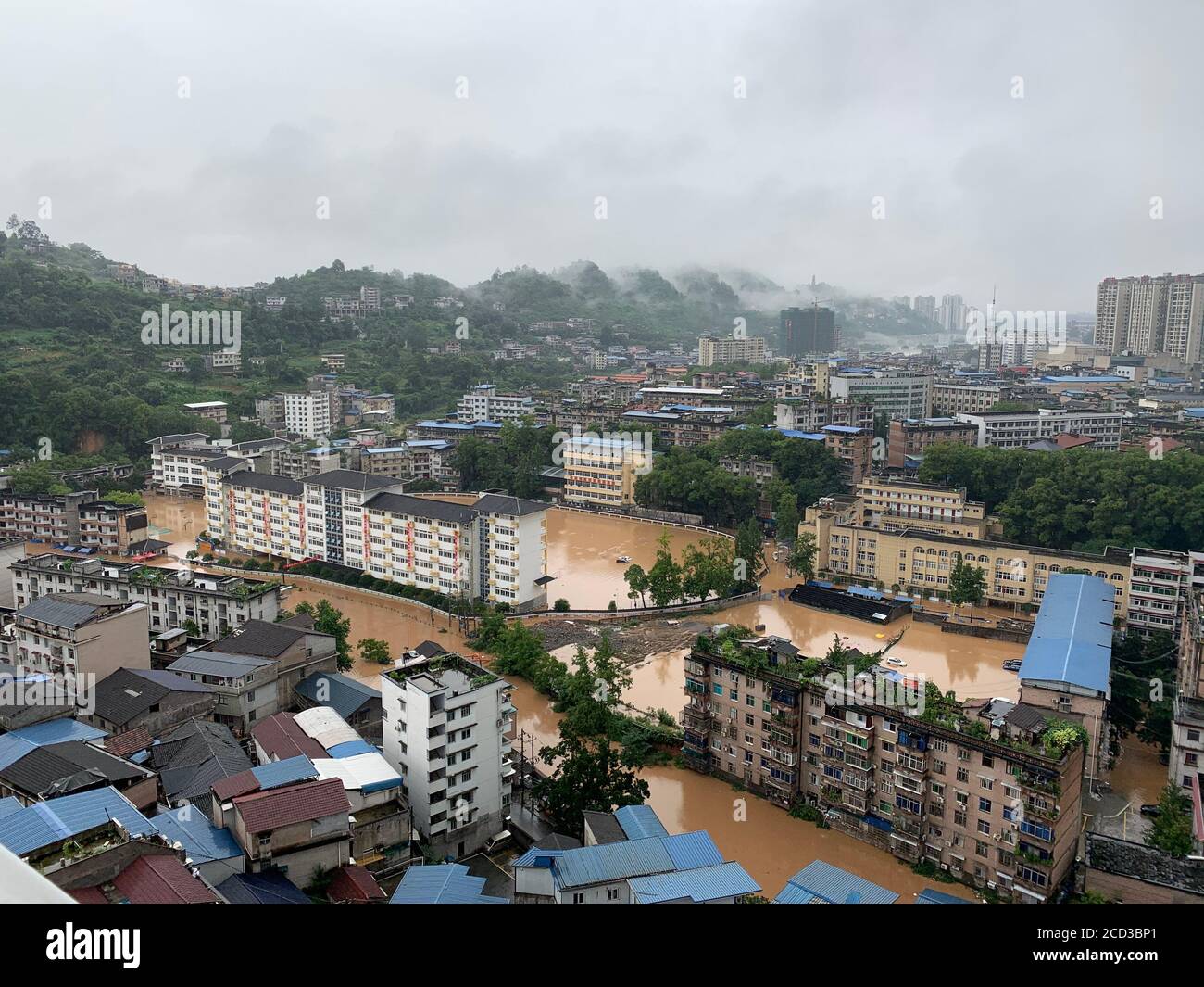 Aerial view of residential buildings flooded in Enshi city, south China's Hubei province, 17 July 2020. Stock Photo