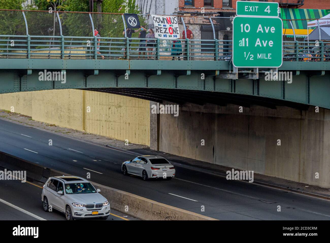 USA. 18th Aug, 2020. Protesters holding a No Gowanus Rezoning banner at the overpass. Gowanus residents organized a banner drop during rush hour at an overpass over the Prospect expressway in Brooklyn on August 18, 2020 to call on elected officials to oppose the proposed Gowanus rezoning. (Photo by Erik McGregor/Sipa USA) Credit: Sipa USA/Alamy Live News Stock Photo