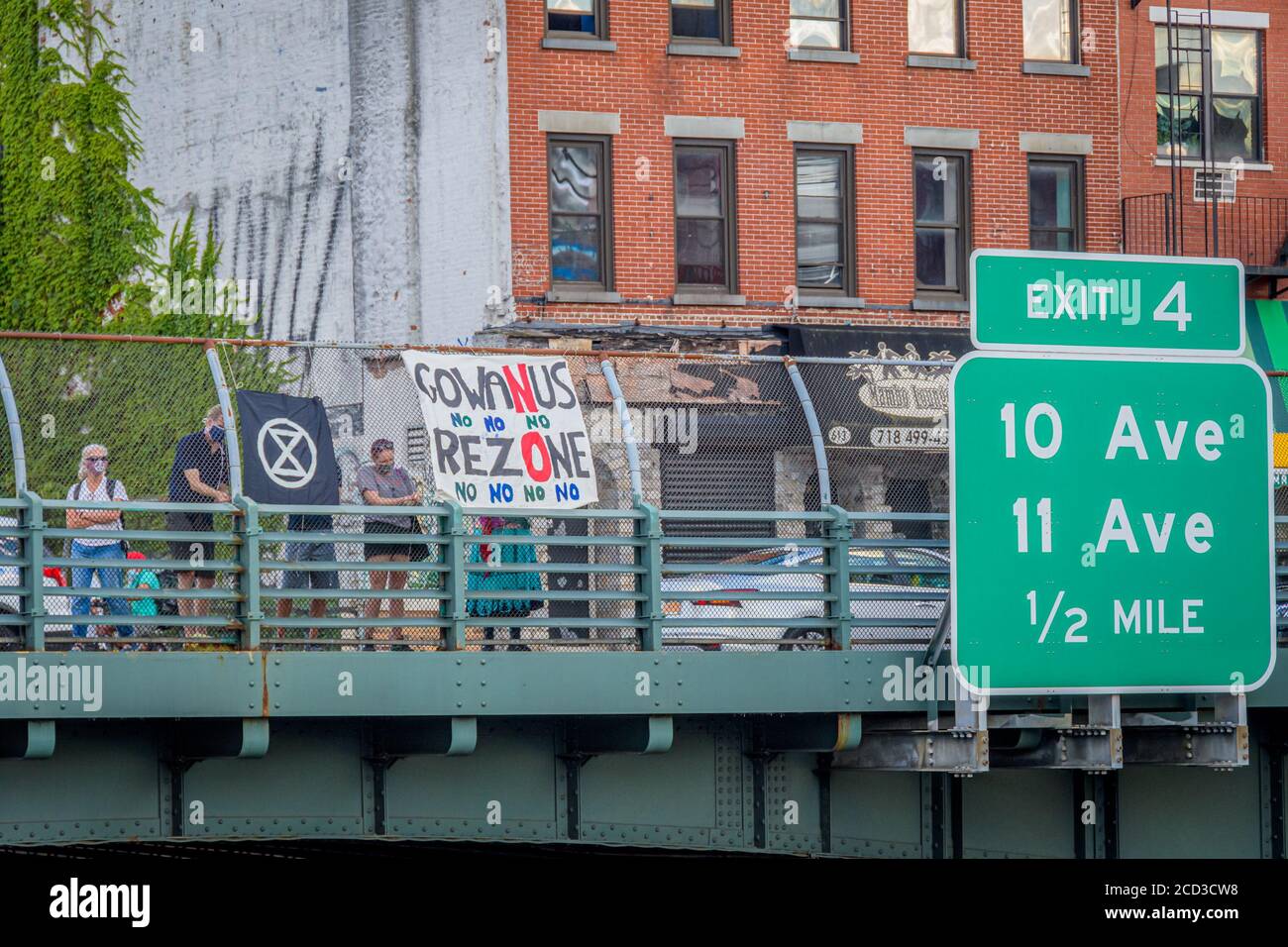 USA. 18th Aug, 2020. Protesters holding a No Gowanus Rezoning banner at the overpass. Gowanus residents organized a banner drop during rush hour at an overpass over the Prospect expressway in Brooklyn on August 18, 2020 to call on elected officials to oppose the proposed Gowanus rezoning. (Photo by Erik McGregor/Sipa USA) Credit: Sipa USA/Alamy Live News Stock Photo