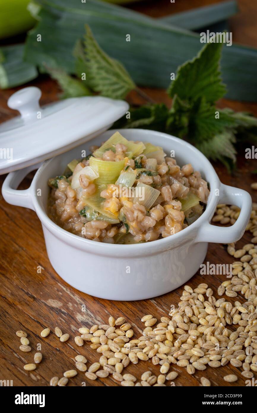 Barley risotto in casserole dish Stock Photo
