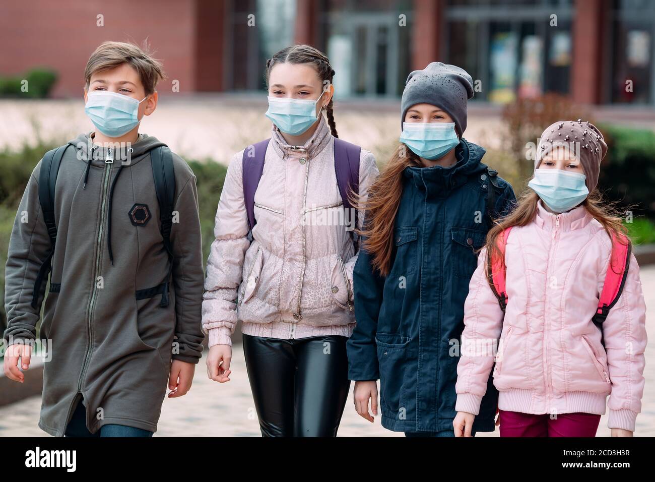 Group schoolchildren in medical masks hi-res stock photography and ...