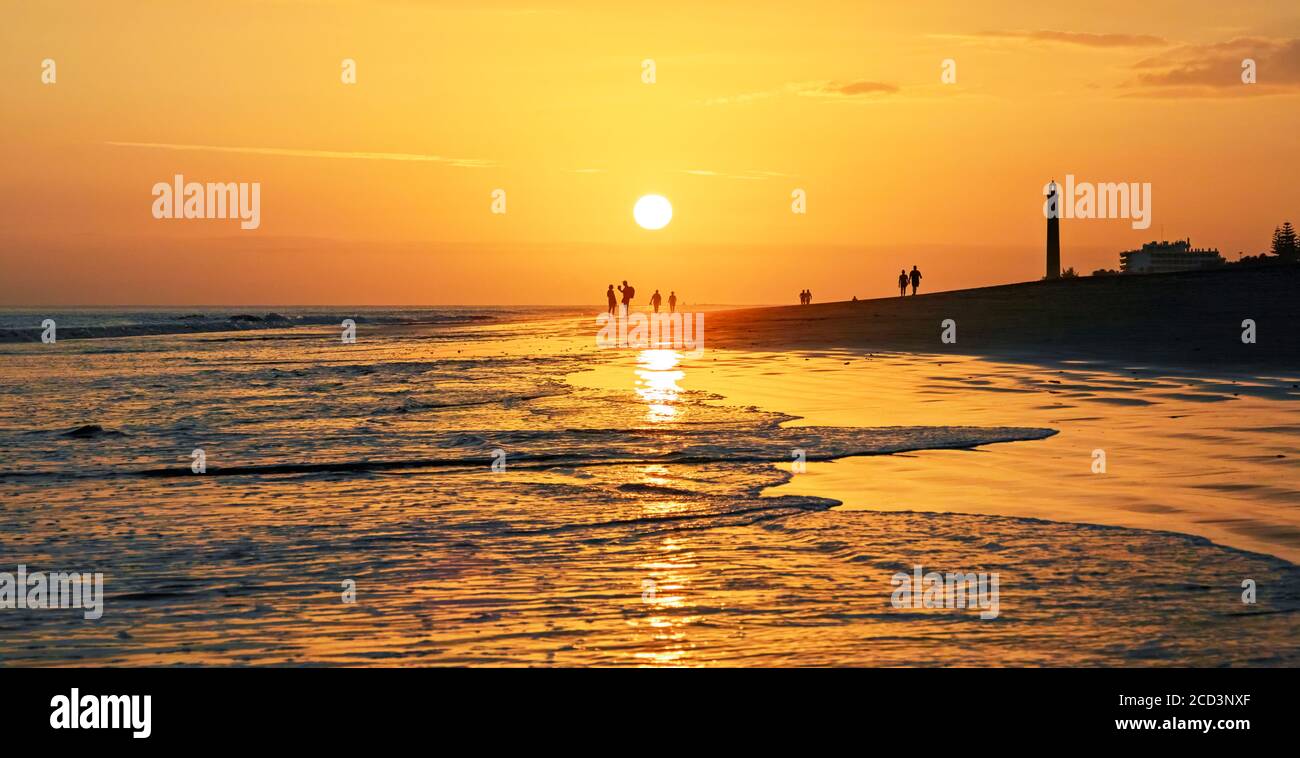 sunset at the beach, lighthouse maspalomas gran canaria Stock Photo