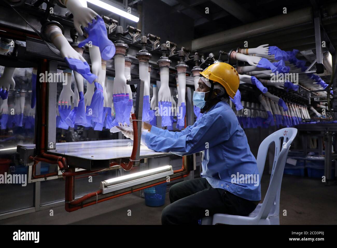 A Worker Inspects Newly Made Gloves At Top Glove Factory In Shah Alam Malaysia August 26 2020 Reuters Lim Huey Teng Stock Photo Alamy