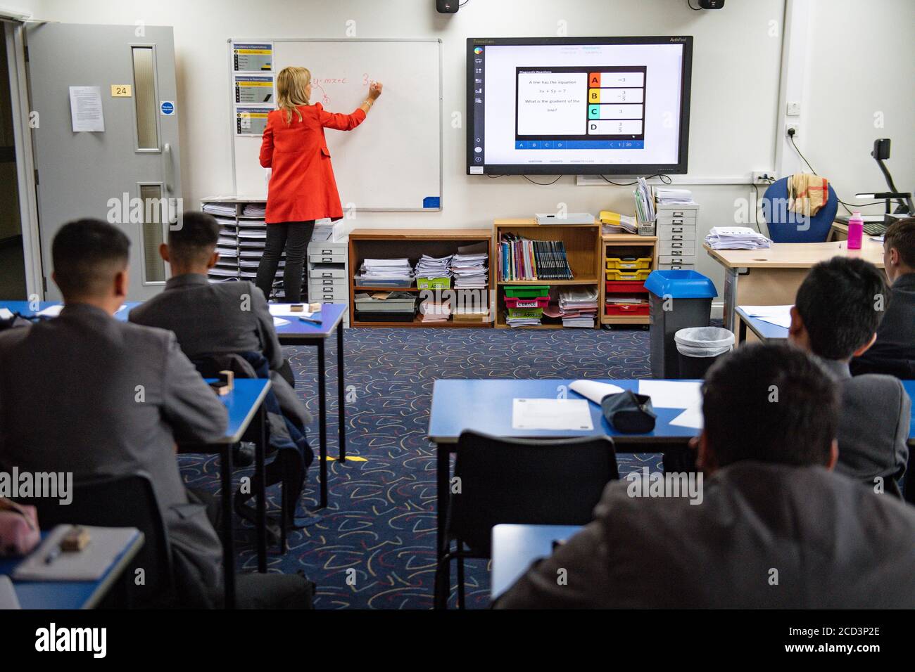 Pupils from years 7 and 11 return to Manor High School in Oadby, Leicestershire, currently the school has adopted a voluntary policy with regards to students wearing face coverings. Stock Photo