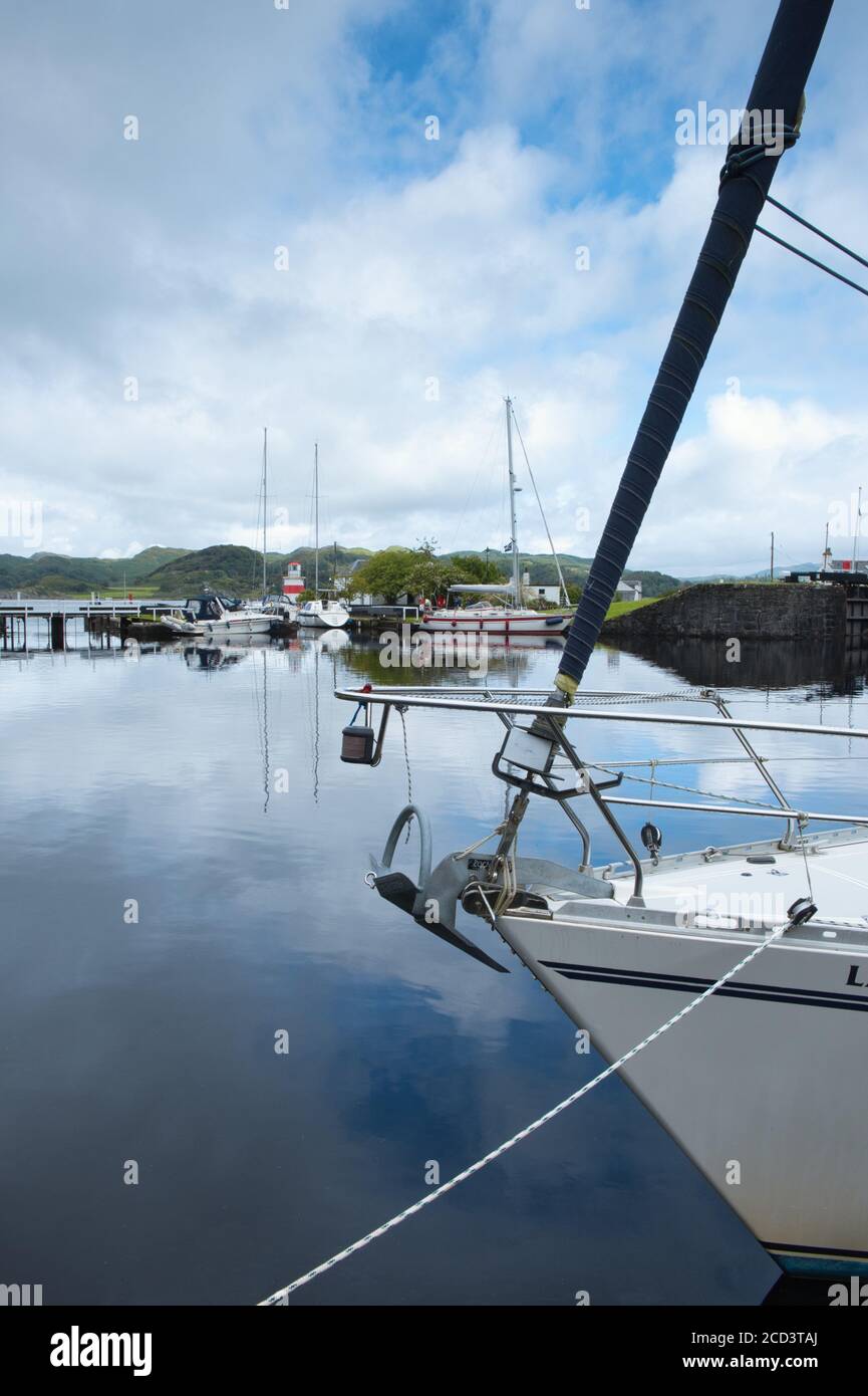 Looking across the lock basin at moored boats on the Crinan Canal. Crinan village, by Lochgilphead Scotland· PA31 8SR Stock Photo