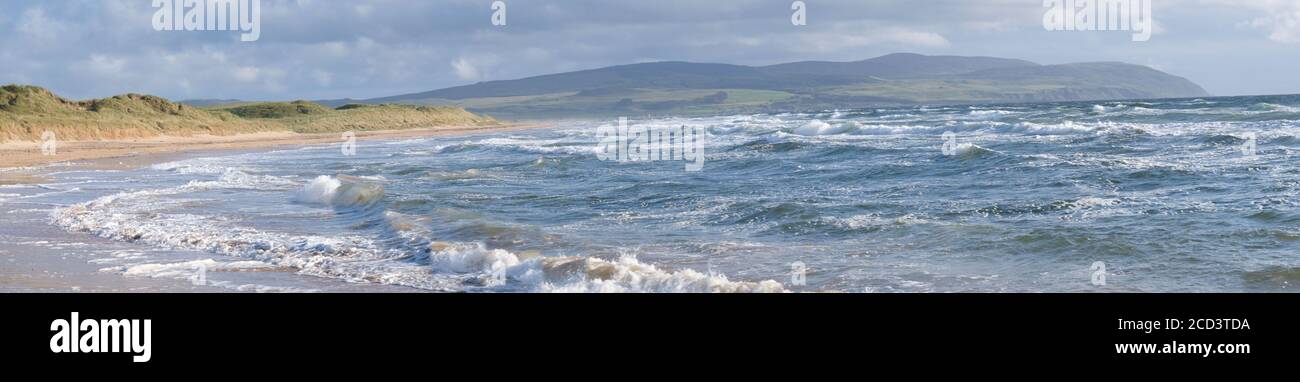 Westport beach in Kintyre is popular with surfers having wave that come in from the Atlantic. Stock Photo