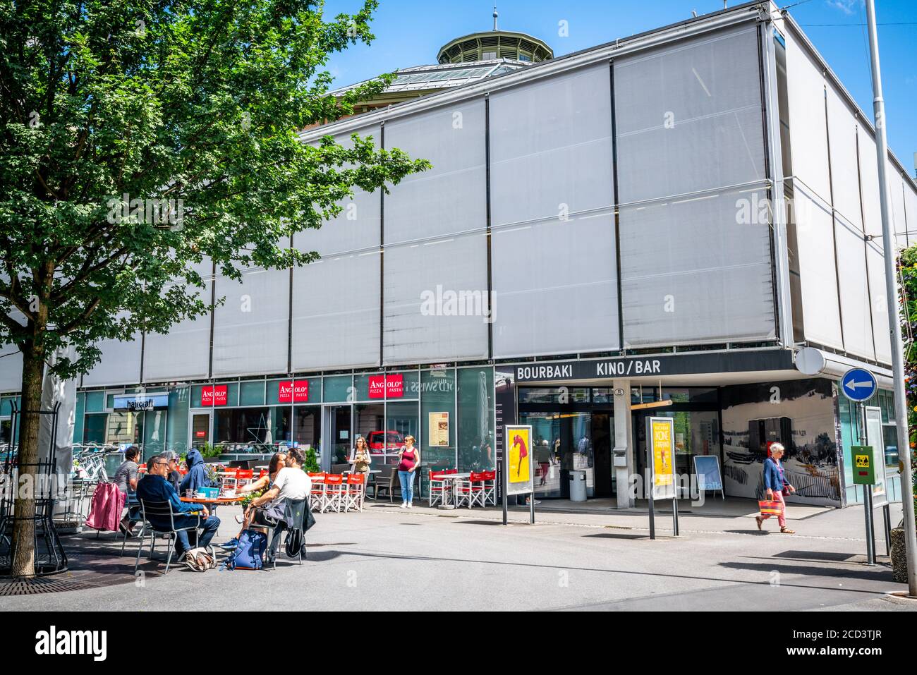 Lucerne Switzerland , 29 June 2020 : People at a restaurant terrace in front of Bourbaki panorama building with entrance view in Lucerne Switzerland Stock Photo