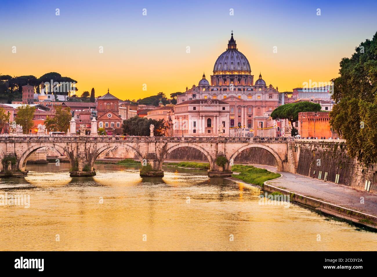 Rome, Italy - Vatican city with Basilica San Pietro, sunset over Tevere River. Stock Photo