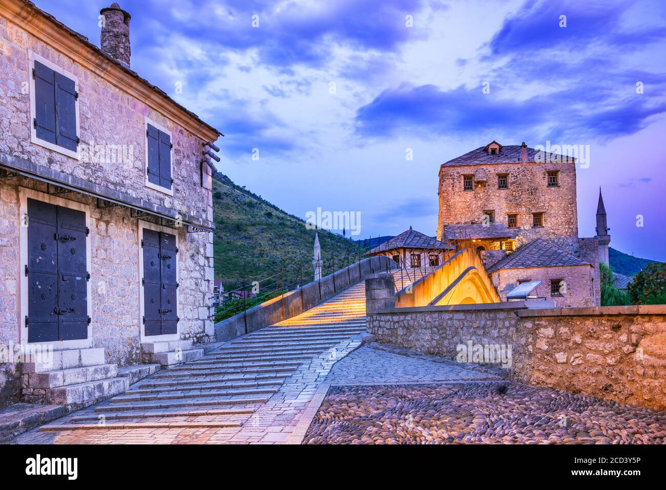 Mostar, Old Town, Bosnia and Herzegovina, Europe. Skyline of Mostar with the Stari Most Bridge, houses and minarets, at sunrise. Stock Photo