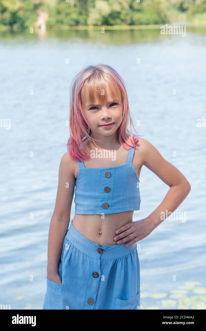 cute child girl portrait . Outdoor portrait of cute little girl in summer  day. Portrait of a little girl with pink hair. Child 7-8 years old.  Teenager Stock Photo - Alamy