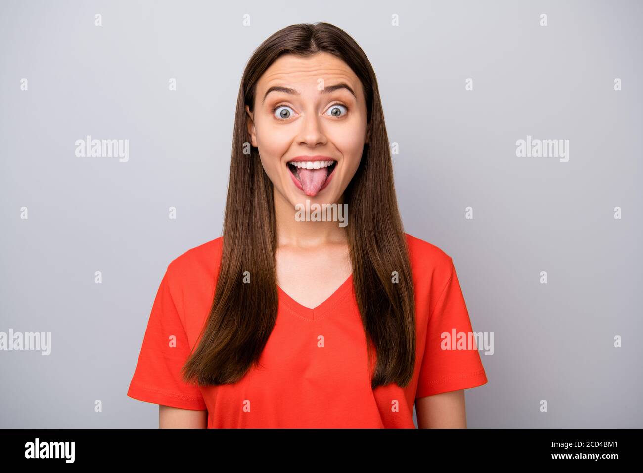 Close-up portrait of her she nice-looking attractive lovely funky funny cheerful cheery straight-haired girl showing tongue out teasing isolated over Stock Photo