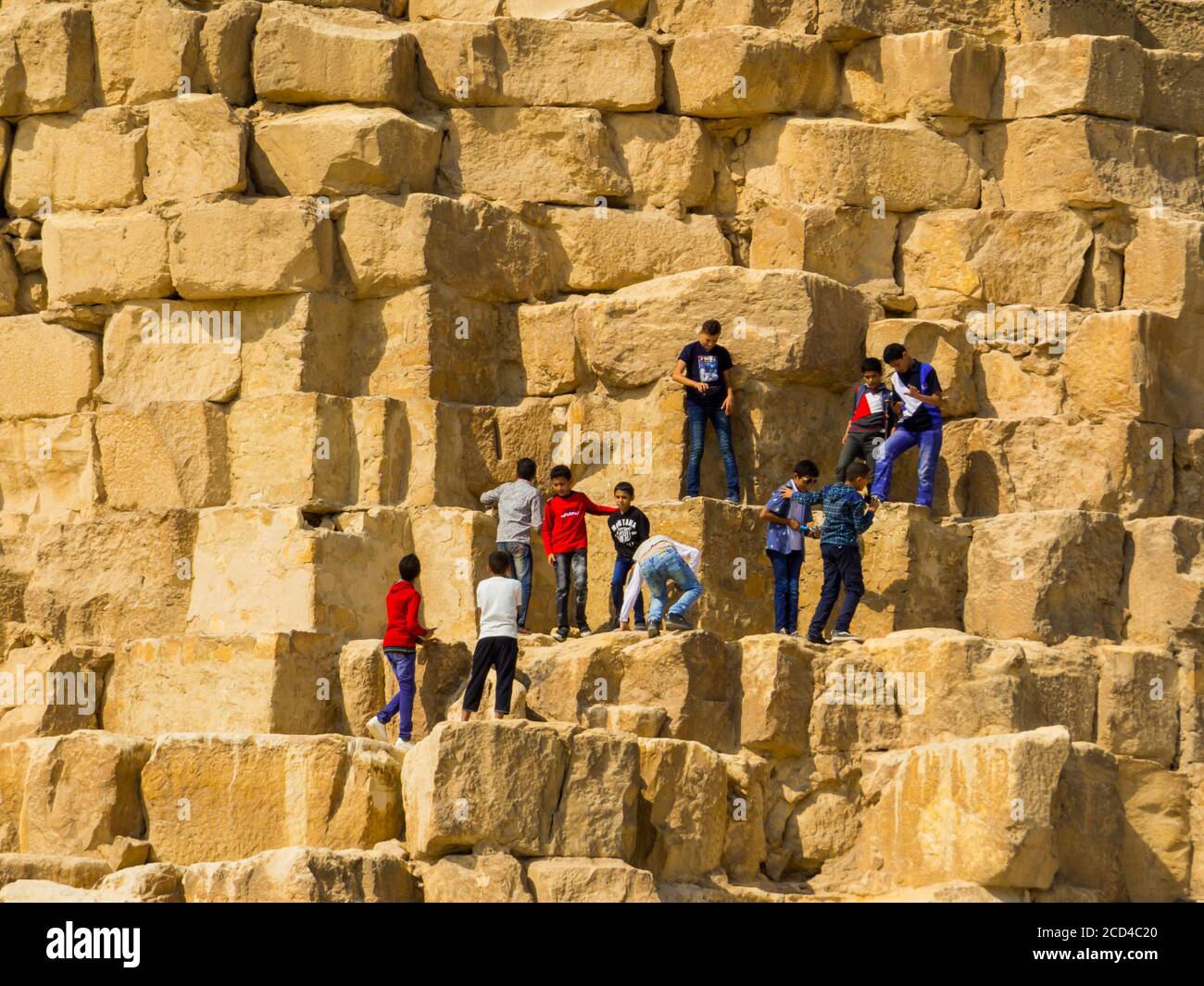 Climbing the Great Pyramid Stock Photo