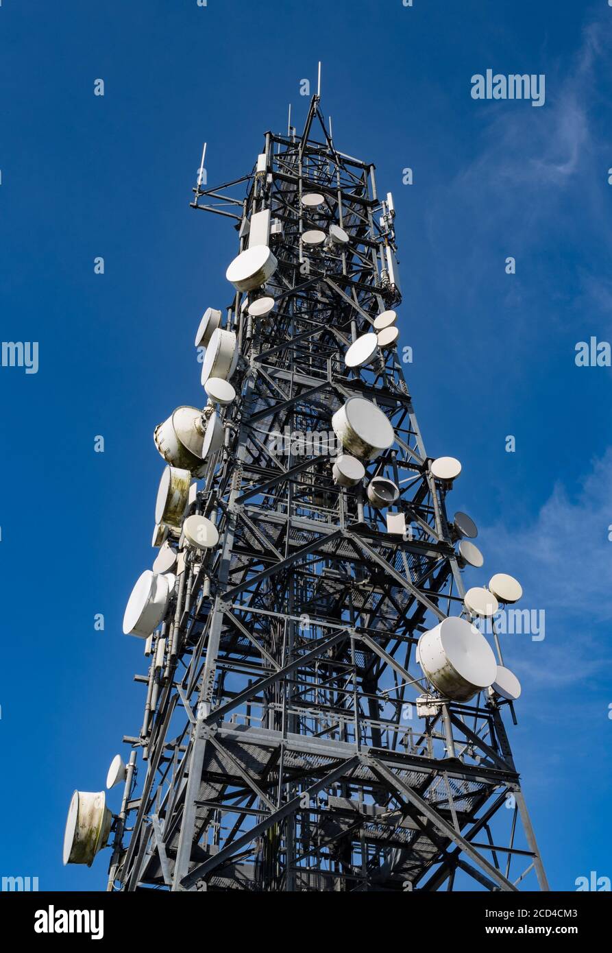 Close up on old Telecommunication tower with blue sky and cloud ...