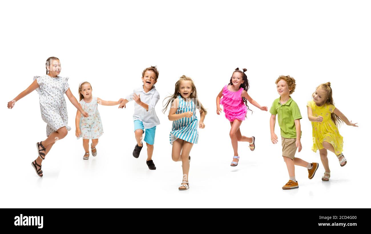 Happy children, little and emotional caucasian kids jumping and running ...