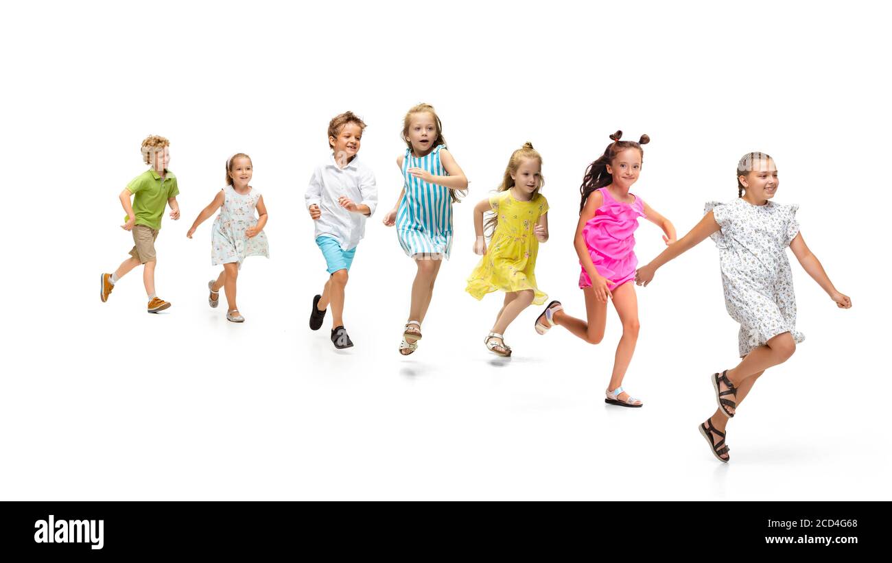 Happy children, little and emotional caucasian kids jumping and running ...