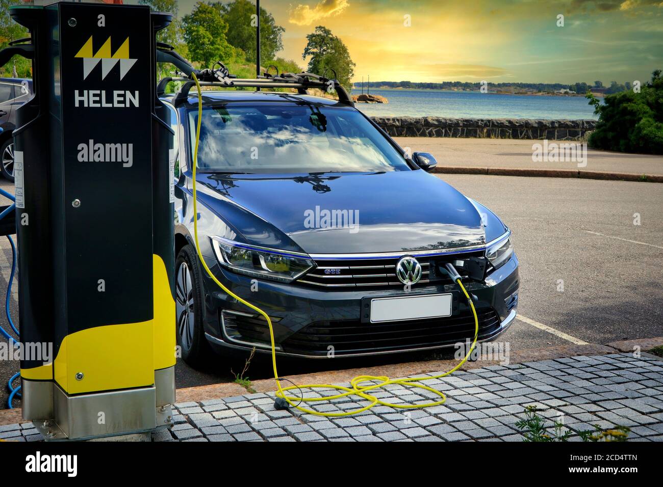 Volkswagen Passat GTE plug-in hybrid electric car charging battery at seaside Helen Charging Point. Helsinki, Finland. August 24, 2020. Stock Photo