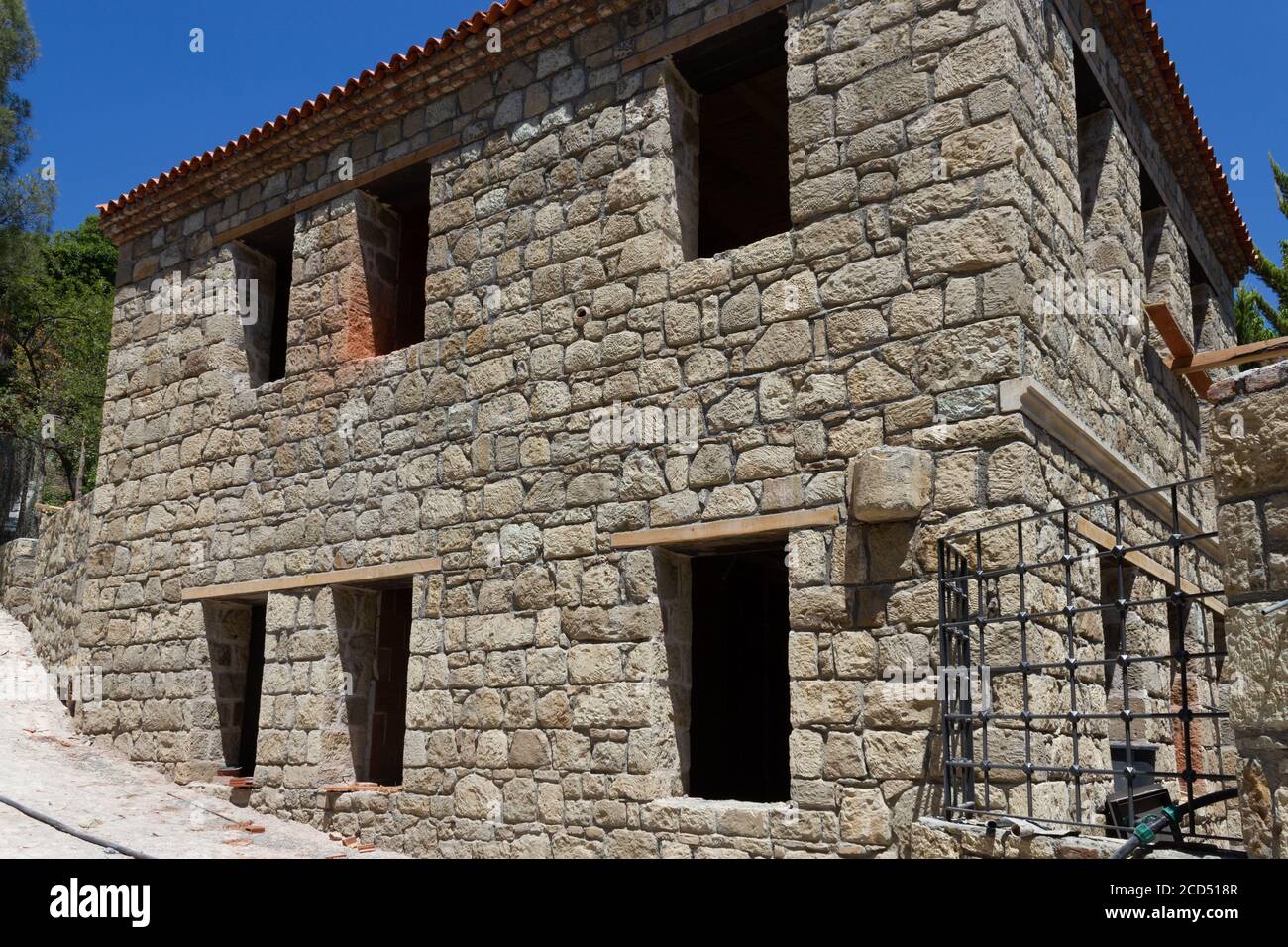 Natural stone house building construction Stock Photo