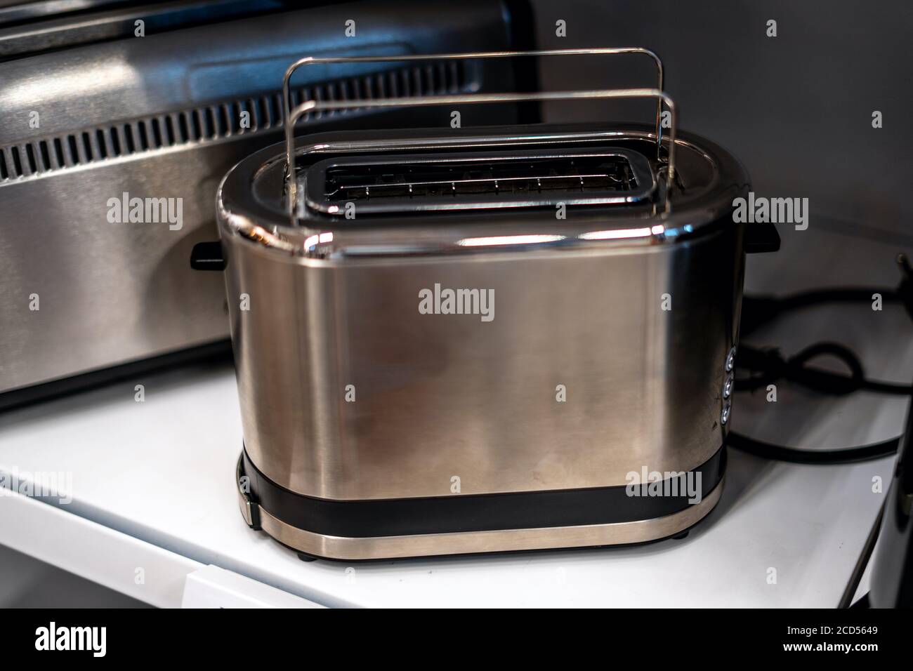 https://c8.alamy.com/comp/2CD5649/studio-shot-toasters-two-slice-stainless-steel-toaster-oven-grey-metal-electric-domestic-kitchen-appliances-selective-focus-2CD5649.jpg