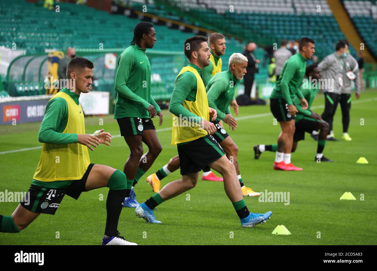 Ferencvaros' Endre Botka (centre) warms up during the UEFA Champions League second qualifying round match at Celtic Park, Glasgow. Stock Photo