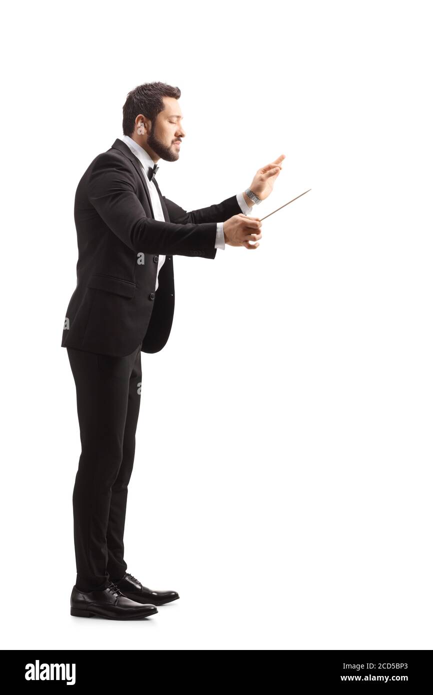 Full length profile shot of a young music conductor directing isolated on white background Stock Photo
