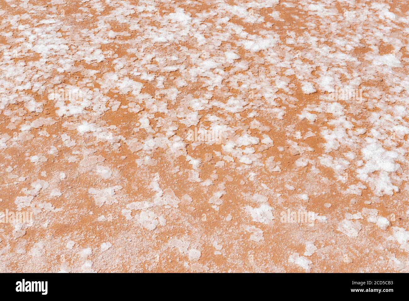 Close up of the best and highest salt quality, a thin crust floating in the salt terraces and ponds of Maras called Fleur de Sel, Cusco province, Peru Stock Photo