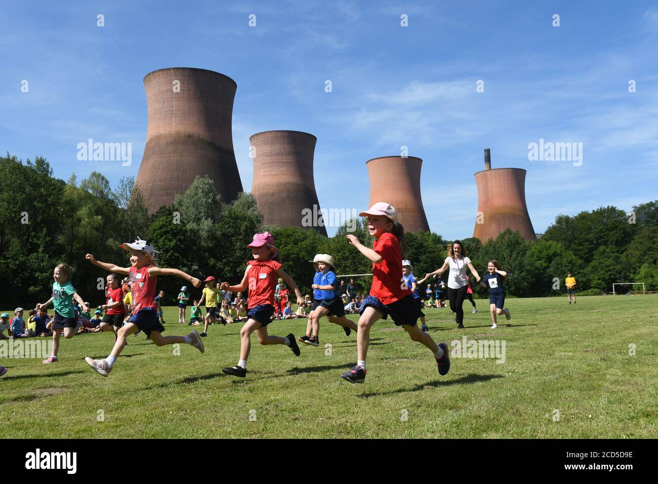 School sports day overlooking the Ironbridge Power Station cooling towers Stock Photo