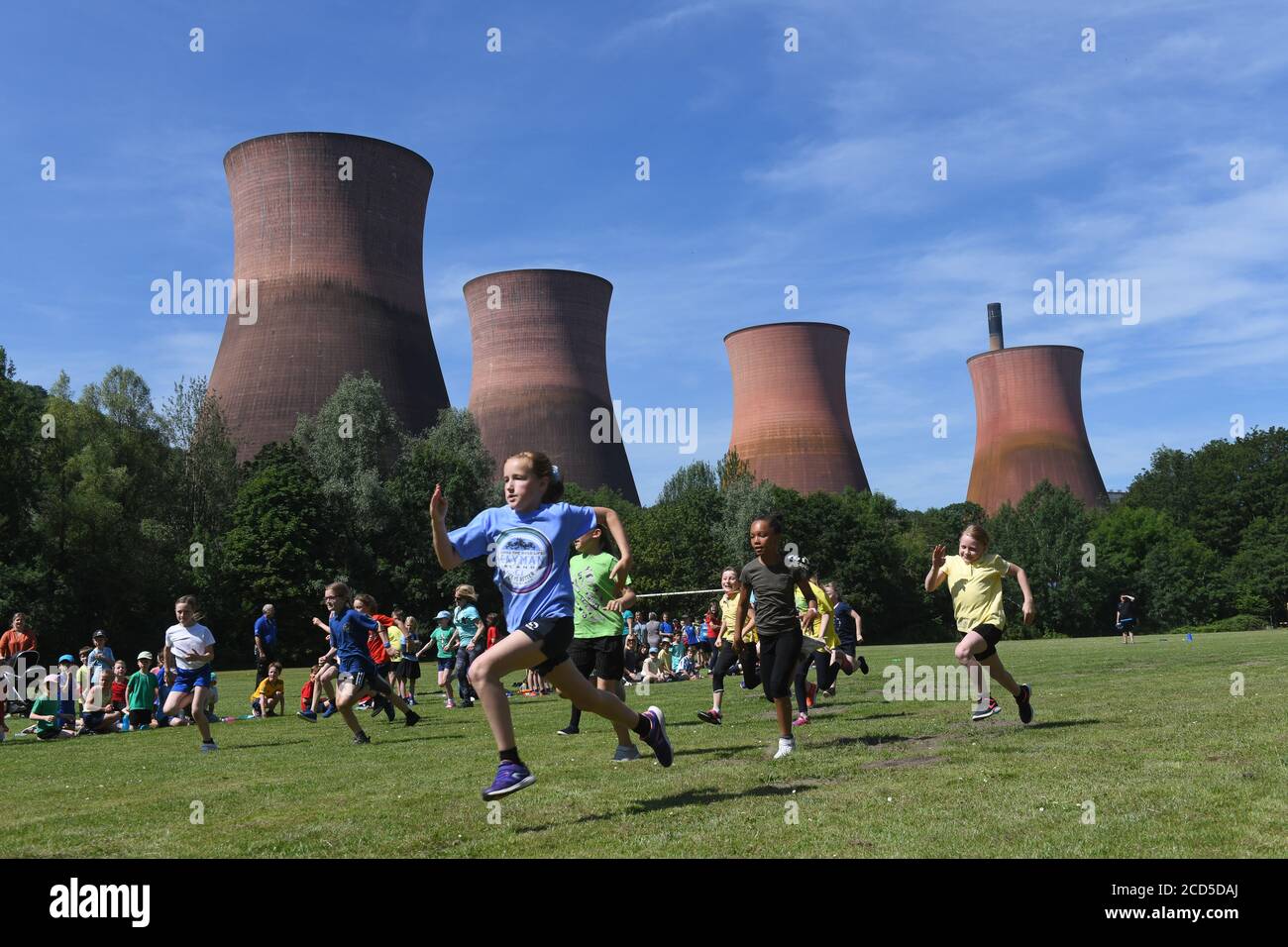 School sports day overlooking the Ironbridge Power Station cooling towers Stock Photo
