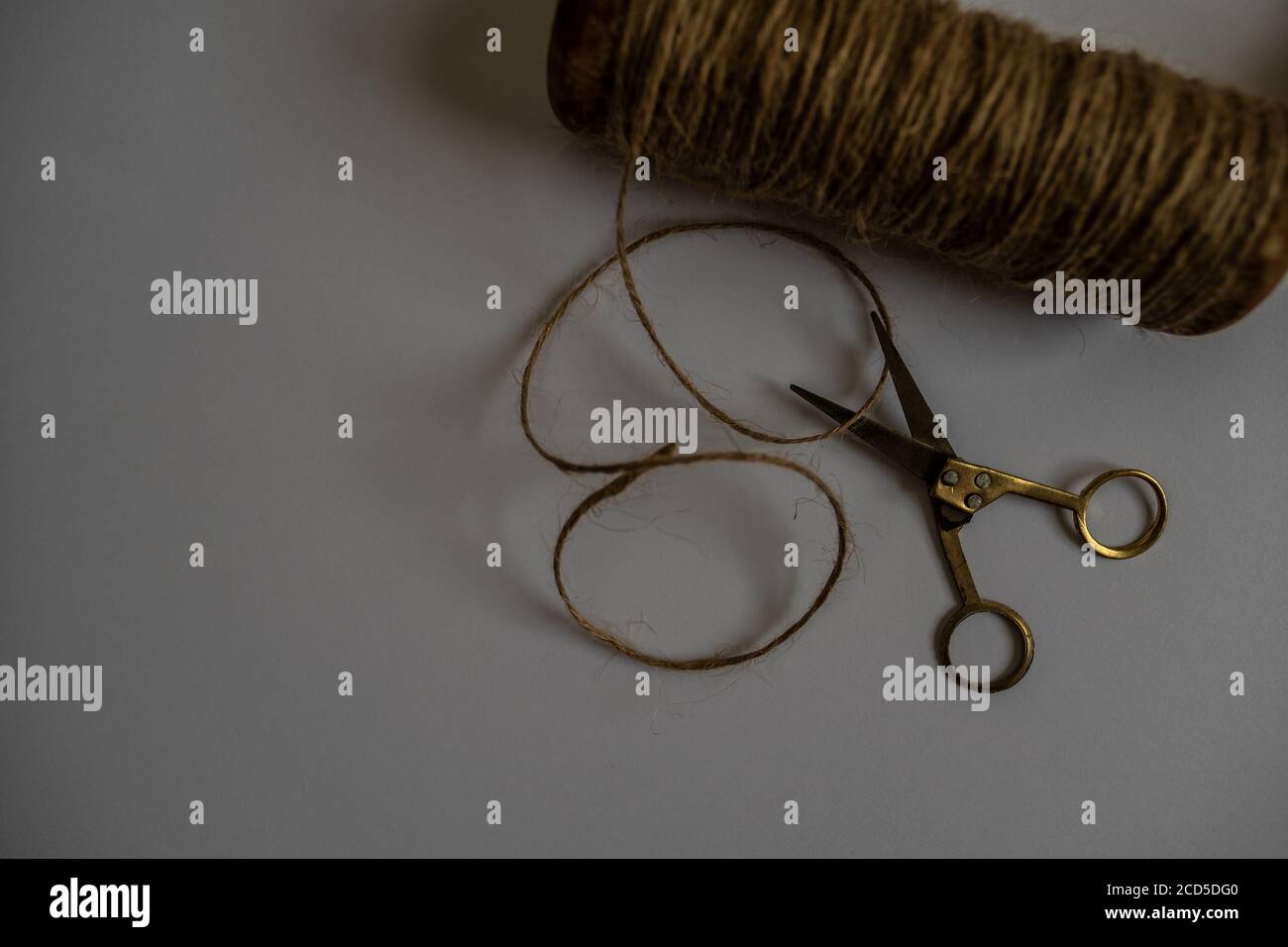 Spools of burlap threads or jute twine on white Stock Photo - Alamy