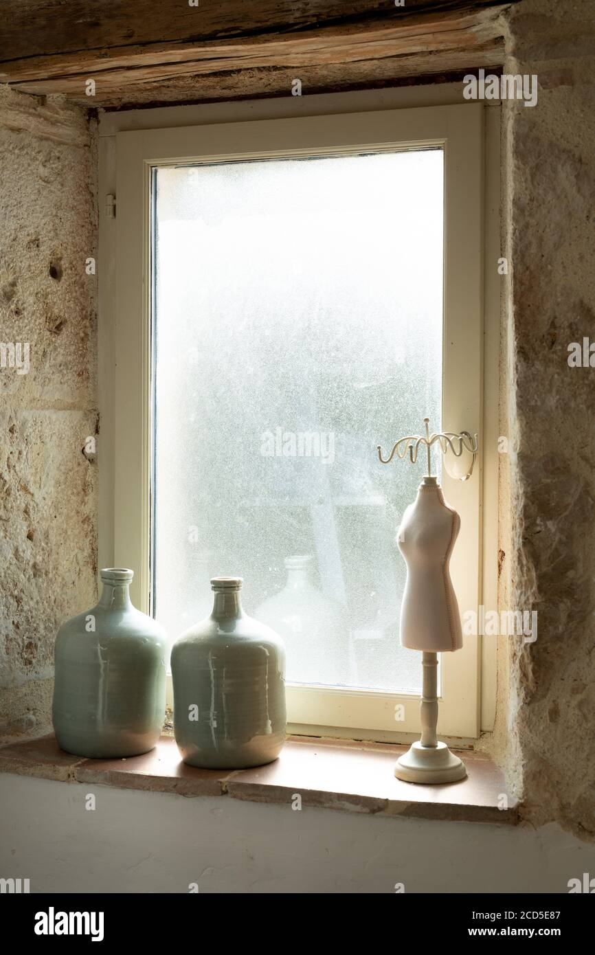 Ornaments on the window sill of a bathroom Stock Photo - Alamy