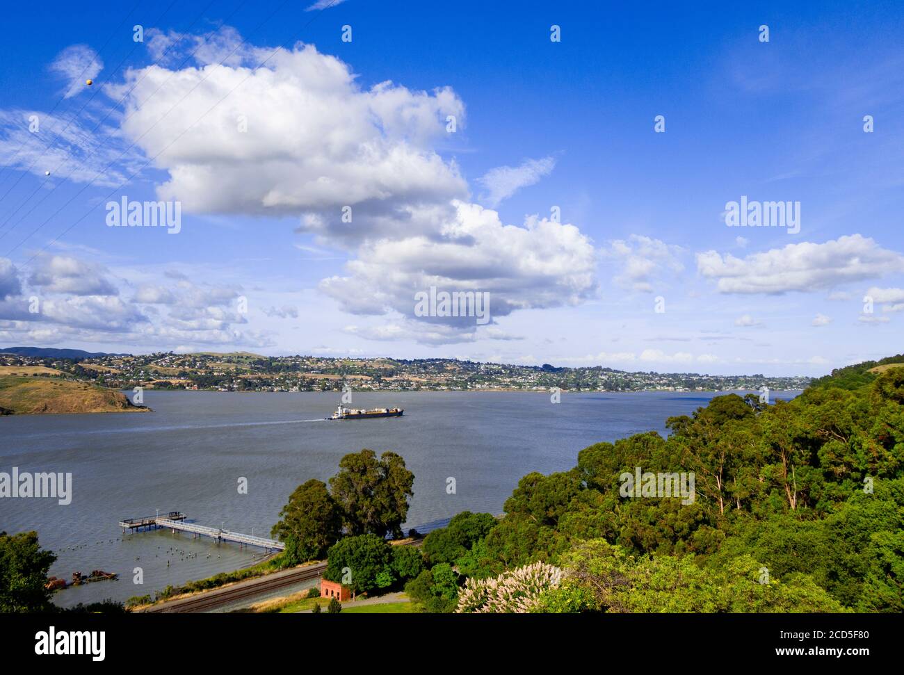 Distant view of container ship in Carquinez Strait, Vallejo, California, USA Stock Photo