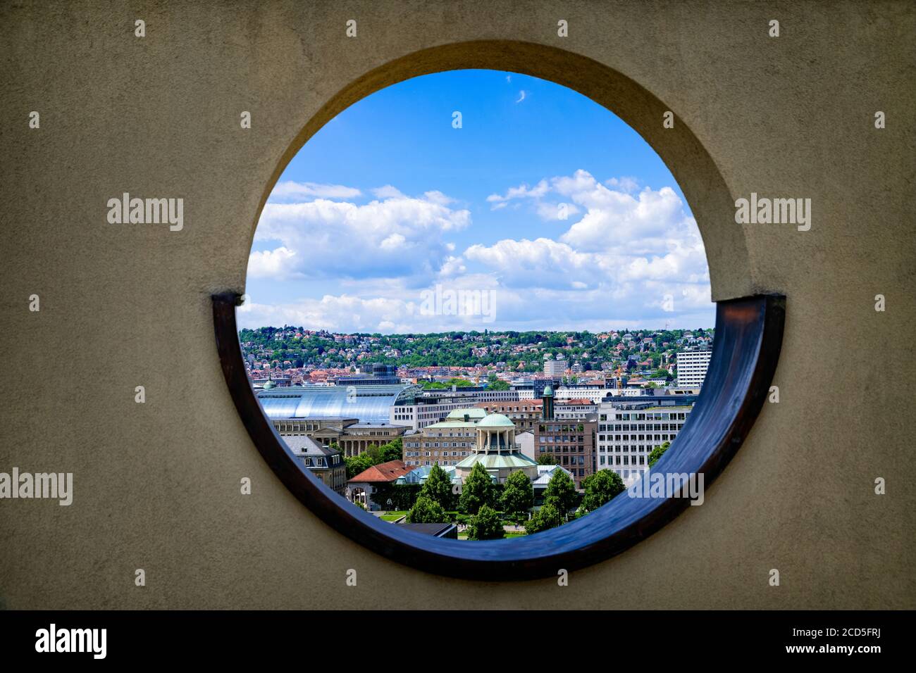 View of city through round window Stock Photo