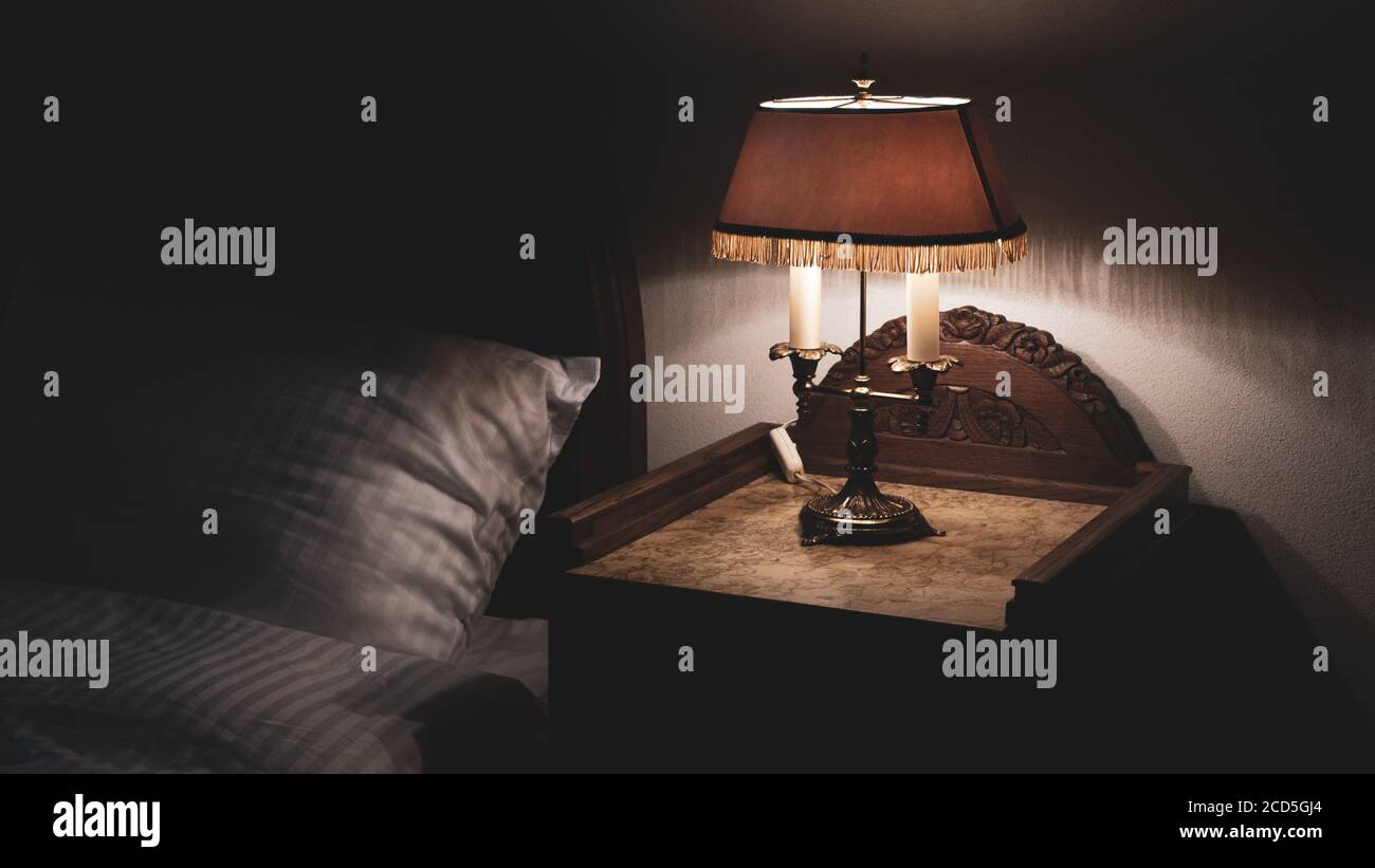Bedside Nightstand Table With Antique Retro Vintage Lamp Low Key Photography Relaxing Bedtime Stock Photo Alamy
