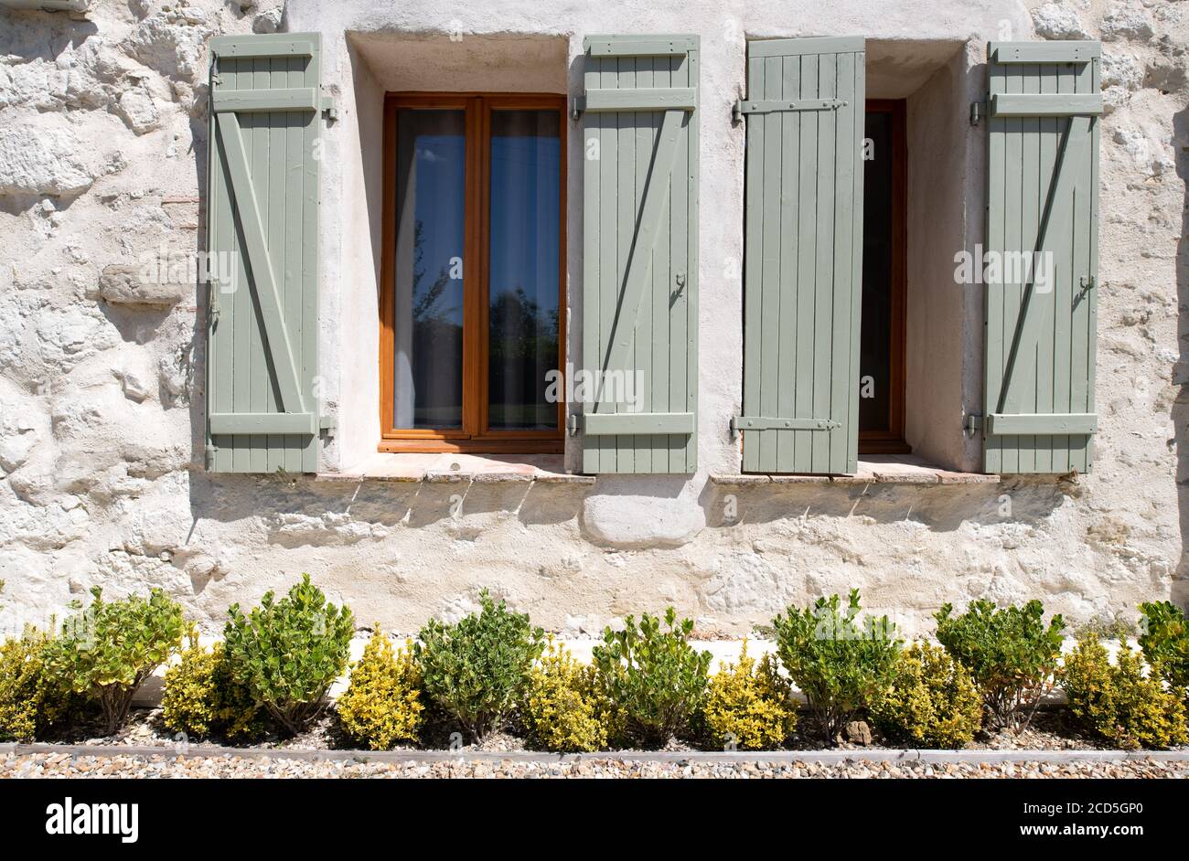 open wooden window shutters on a french house Stock Photo