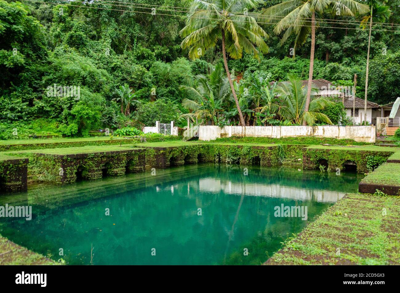 The ancient laterite water tank at Surla Mosque in Surla, Bicholim, Goa, India Stock Photo