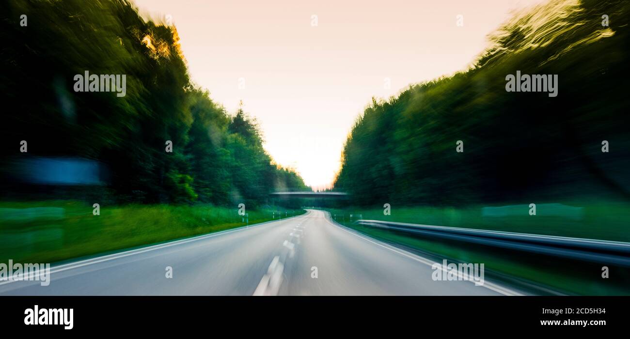 Road surrounded by forest Stock Photo