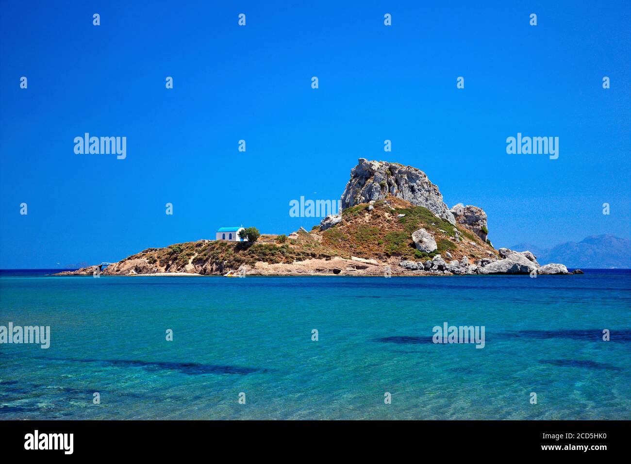 Kastri islet and the chapel of Agios Nikolaos, opposite to the early Christian Basilicas of Agios Stefanos, Kefalos bay, Kos island, Greece. Stock Photo