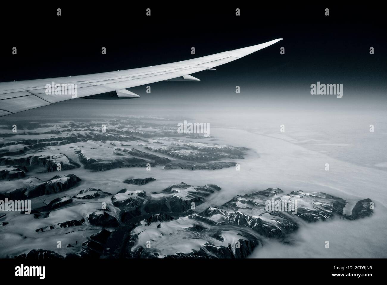 View of airplane wing and ice landscape Stock Photo Alamy