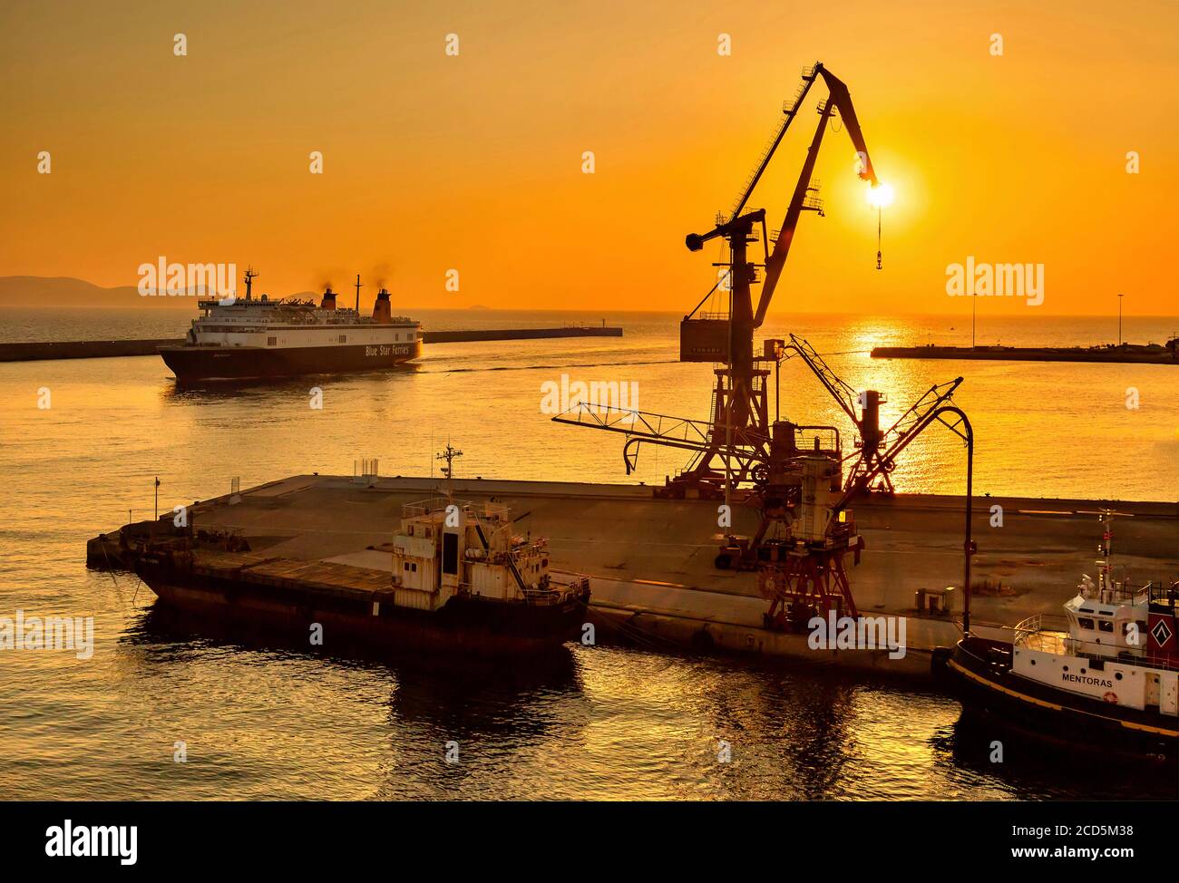 Ship from Piraeus arriving at the port of Heraklion, early in the morning.  Crete, Greece. Stock Photo