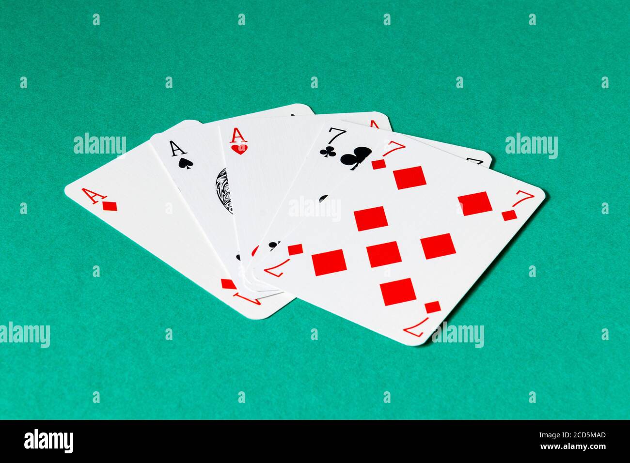 A full house of aces and sevens in a game of poker Stock Photo