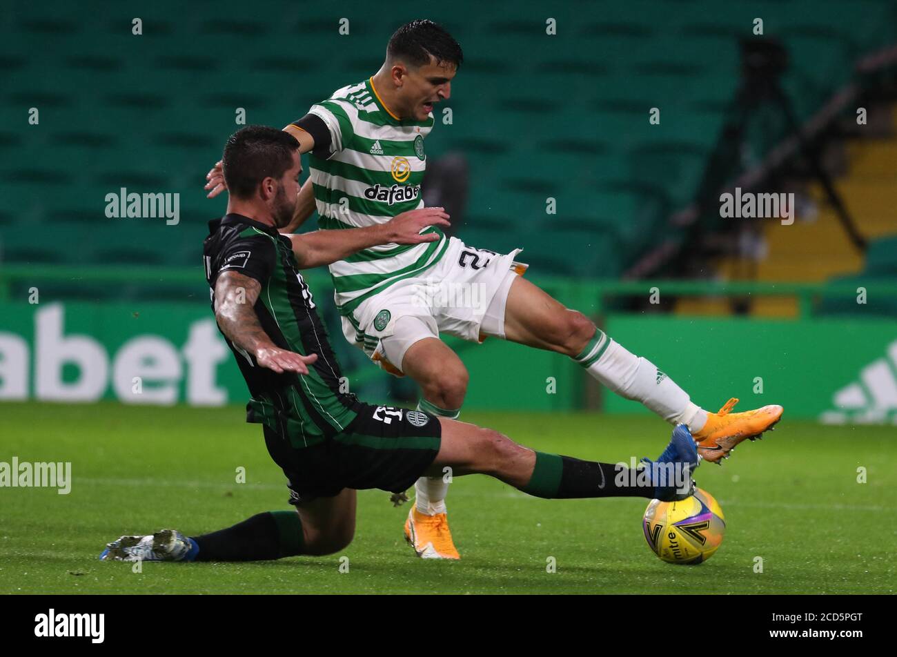 Celtic's Mohamed Elyounoussi (right) and Ferencvaros' Endre Botka battle for the ball during the UEFA Champions League second qualifying round match at Celtic Park, Glasgow. Stock Photo