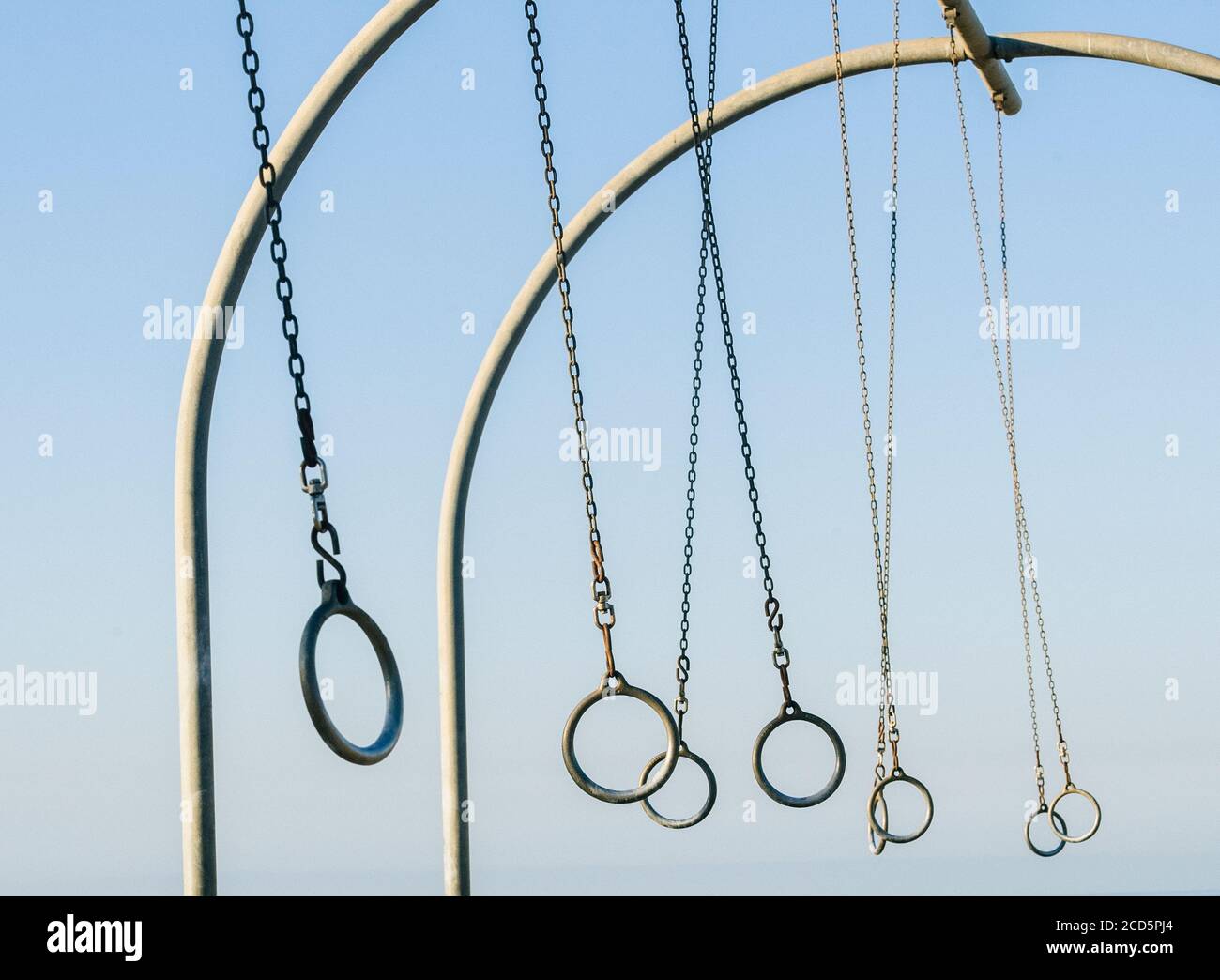 Gymnastic rings hanging from swing set on beach near Santa Monica Pier, Santa Monica, California, USA Stock Photo