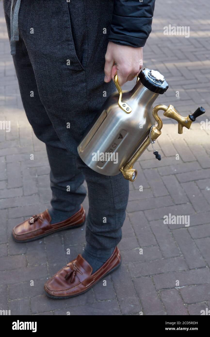 THE HAGUE - A man stands in line at the Free Beer Co to have his growler filled up Stock Photo