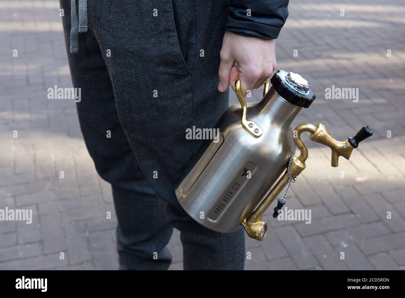 THE HAGUE - A man stands in line at the Free Beer Co to have his growler filled up Stock Photo