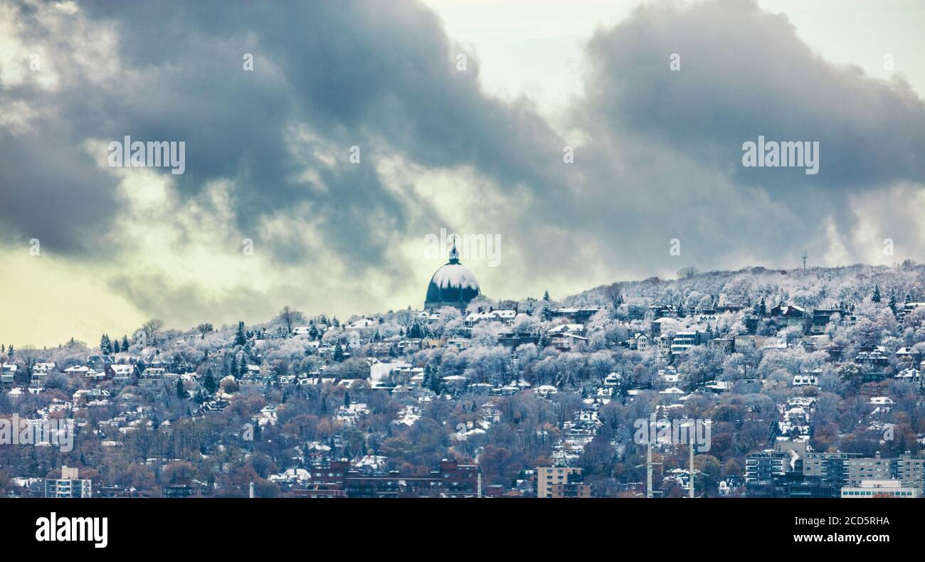 Montreal skyline with first snow falling on Saint Joseph Oratory. Winter view with Mt Royal mount. Quebec Canada city travel North America destination Stock Photo