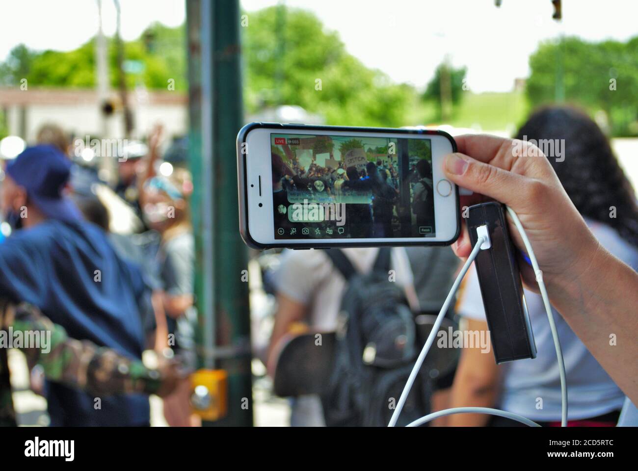 Dayton, Ohio, United States 05/30/2020 people live streaming a black lives matter rally on social media Stock Photo