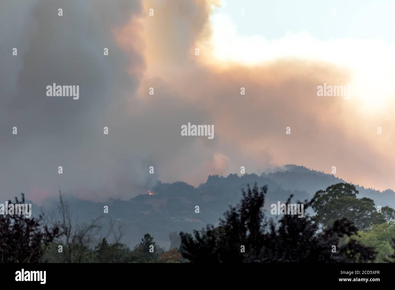 Too Close For Comfort - Flames burn the ridge west of Windsor, CA. Windsor, California, USA Stock Photo